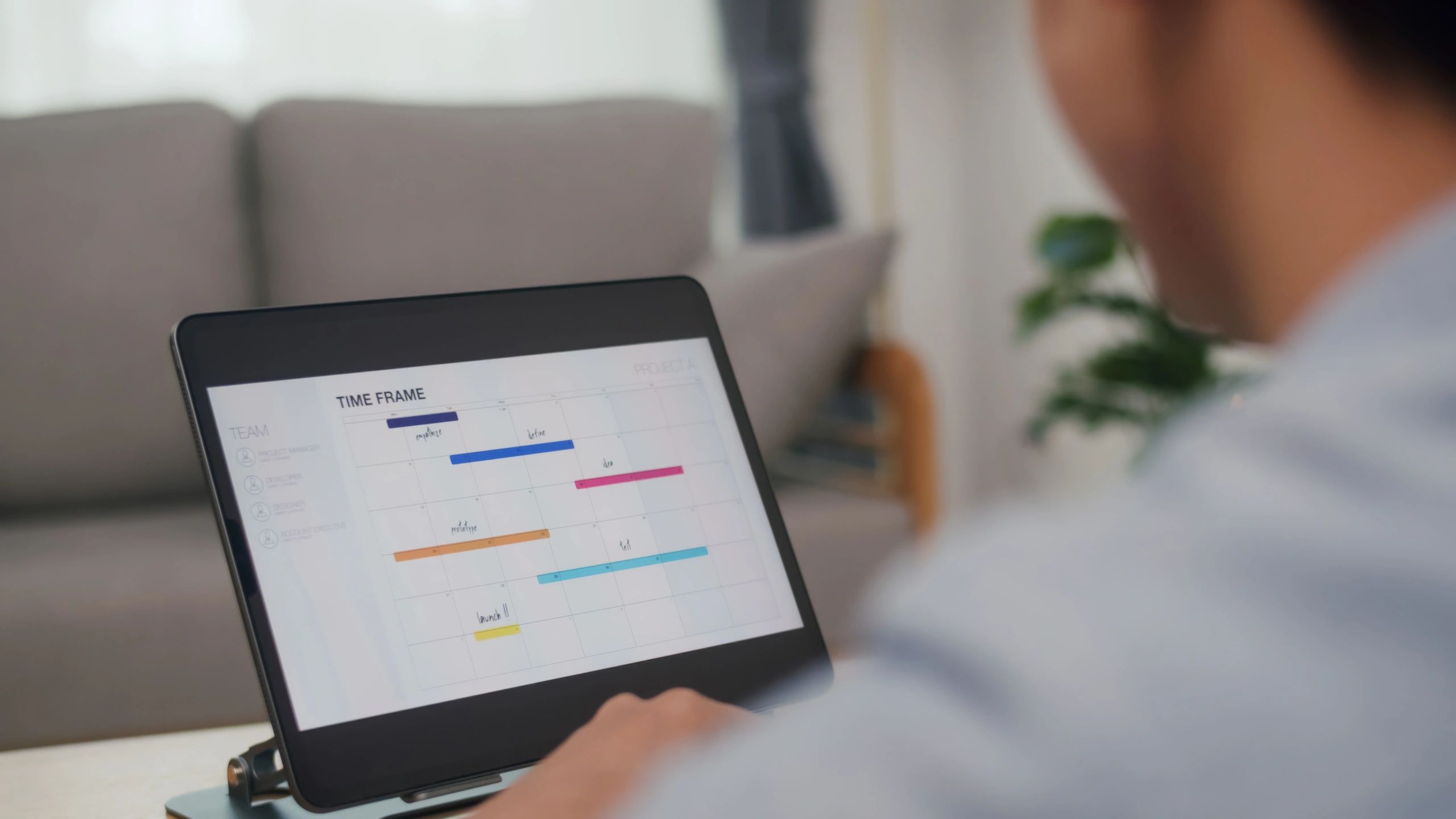 Project schedule displayed on a laptop with a Gantt chart