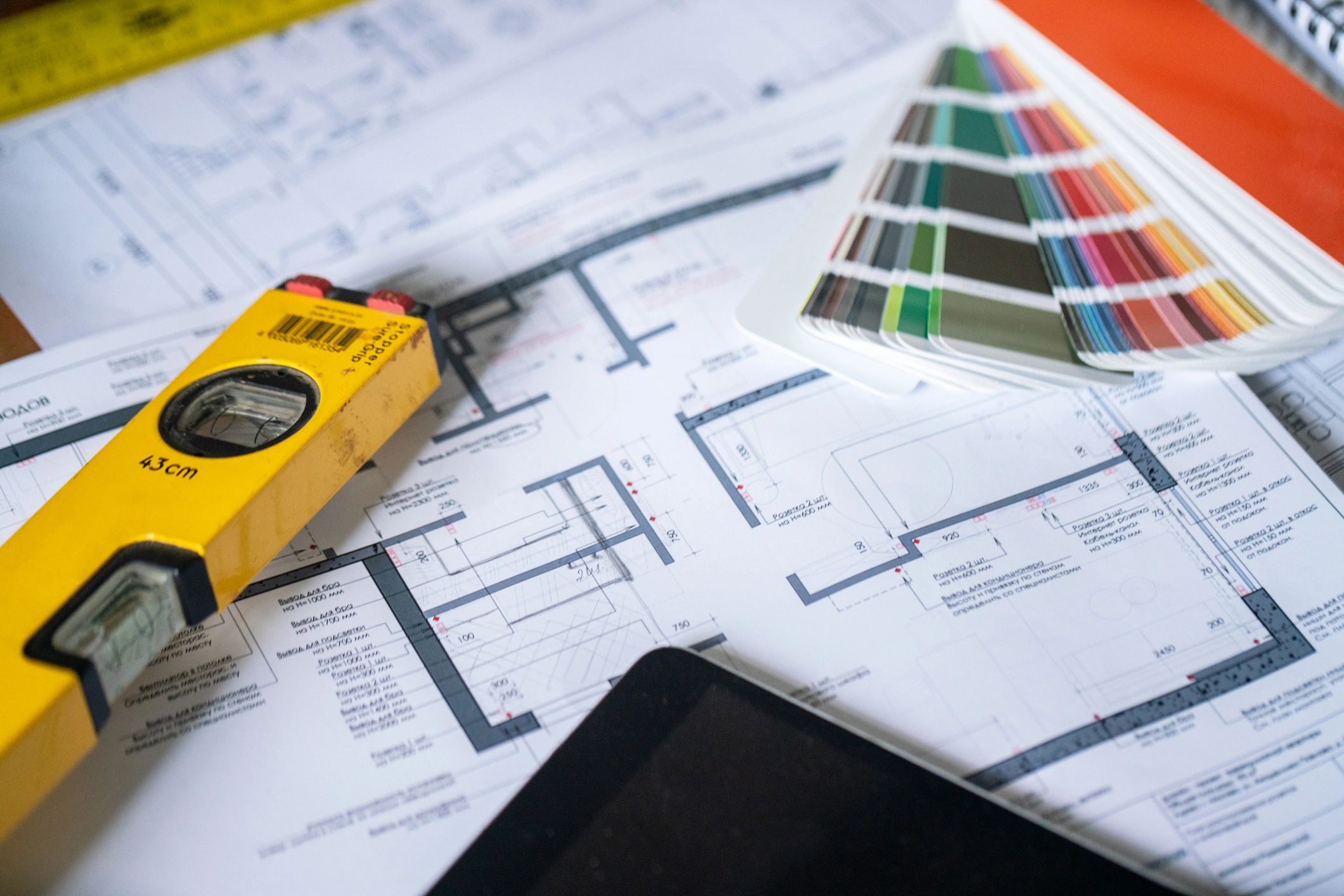 Architectural plans and tools arranged for review