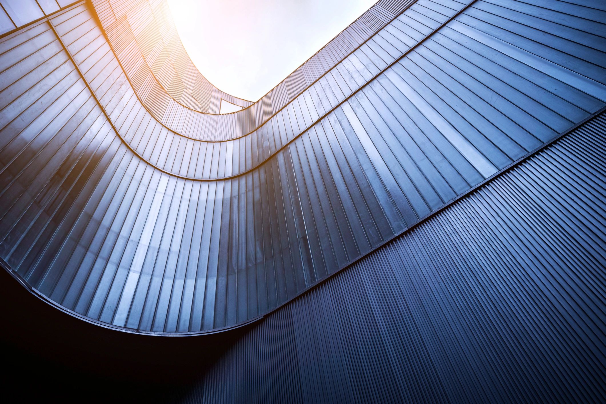 Modern glass building exterior with curved facade